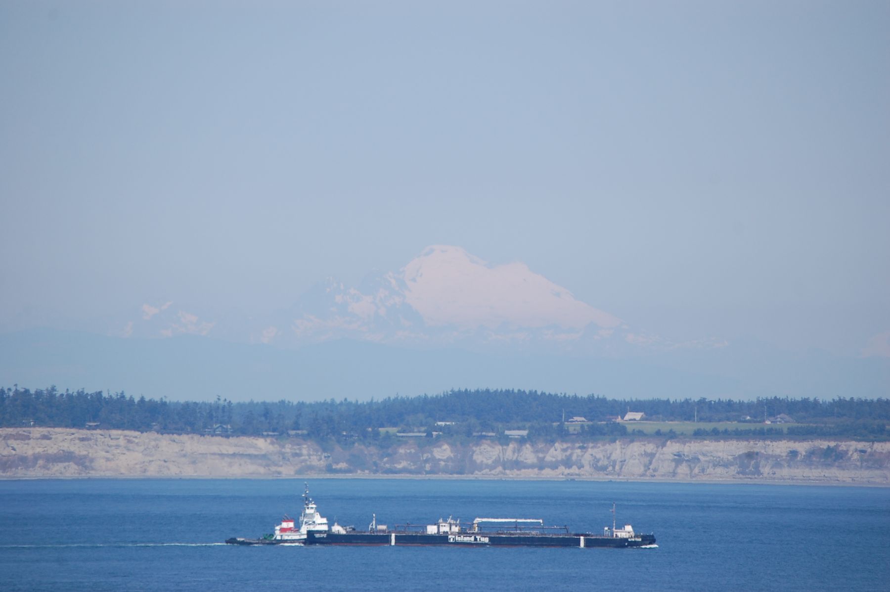 A tug and barge underway on open water
