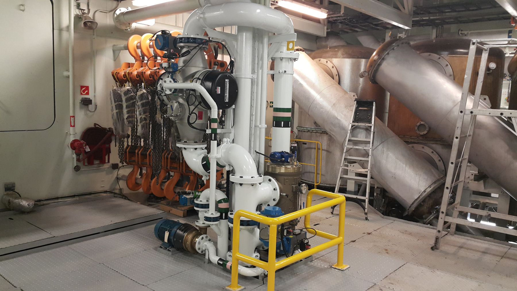 Ballast water treatment pumps and piping in a ship engine room