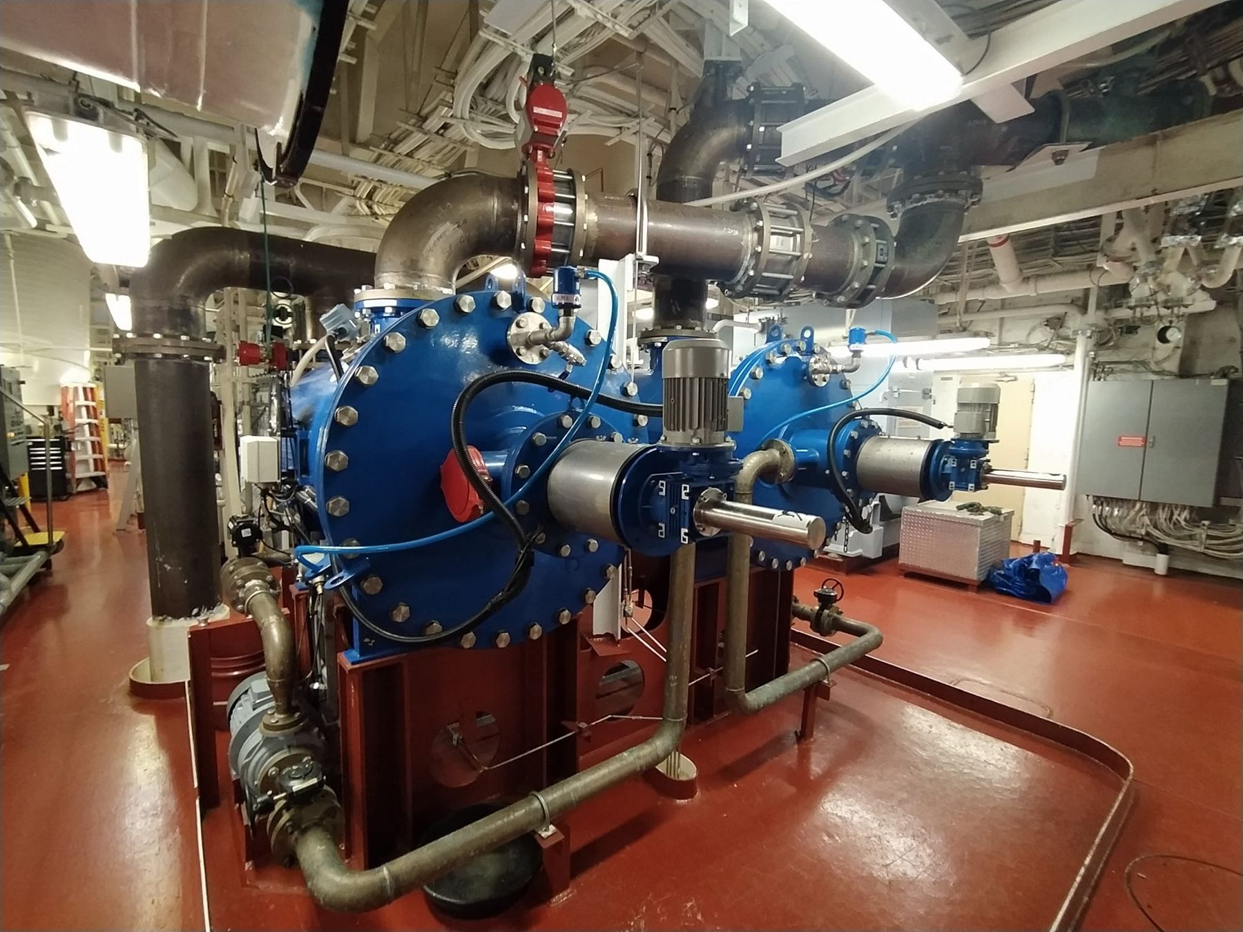 Ballast water treatment pumps and piping in a ship engine room