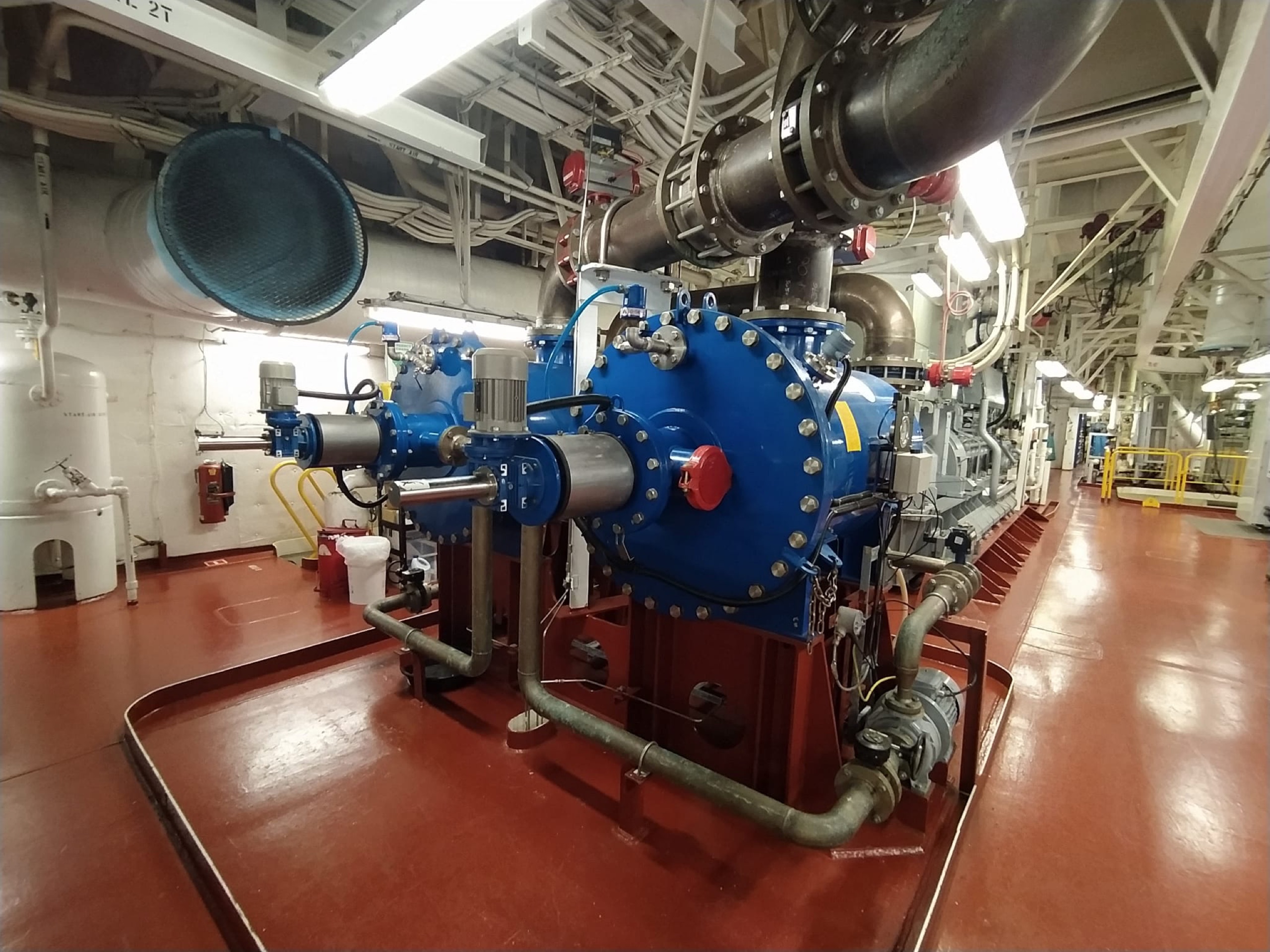 Newly retrofitted ballast water treatment unit in a ship engine room